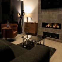 Living area with a fireplace in the Broadford LH702PD