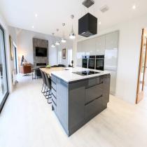 Open-plan kitchen with an island in the Broadford LH702PD