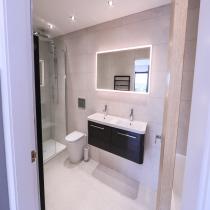 Bathroom with a walk-in shower and double basin in the Broadford LH702PD